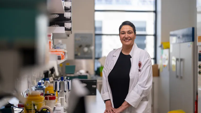 Associate Professor Azure Hermes inside a medical research laboratory